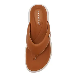 Top-down view of brown leather flip-flops with ergonomic footbed and thick white soles
