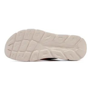 Macro view of non-slip rubber outsole with geometric grip patterns for casual sandals
