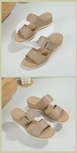 Dettaglio dei sandali con zeppa kaki con cinturini trapuntati e fibbie in metallo
