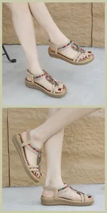 Detail of bohemian wedge sandals featuring colorful braided beads and T-strap design