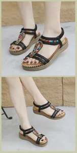Detail of bohemian wedge sandals with colorful beads and textured latex massage sole