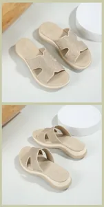 Detail view of beige wedge sandals with sparkling rhinestones and hollow-out strap design