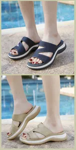 Detail of rhinestone platform wedge sandals in blue and gold colors for summer beach