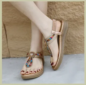 Close-up of Bohemian rhinestone sandals with colorful beads and comfortable wedge sole