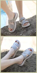 Detail of rhinestone-embellished wedge flip-flops with sparkling cross straps