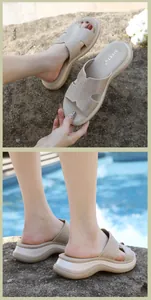 Close-up of beige platform wedge sandals with rhinestone H-shaped strap design