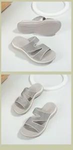 Detailed view of rhinestone cross straps and anti-slip wedge sole of the grey slide sandals