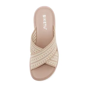 Detailed top view of beige flyknit cross-strap slippers with comfortable thick sole