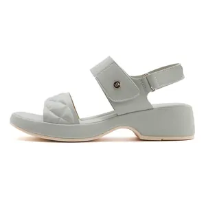 Detail of sage green platform sandal with quilted rhombus texture and metal buckle