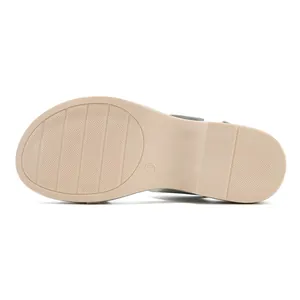 Detail view of anti-slip rubber sole with size 36 marking on beige wedge sandals