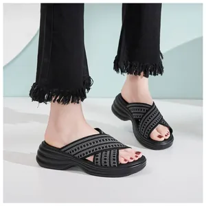 Fashionable platform flip-flops for women featuring black and grey woven cross straps