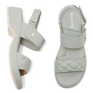 Women's platform wedge sandals with quilted cross straps and adjustable velcro in light green