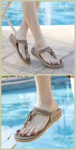 Detail of bohemian khaki sandals with sequins and floral charms by a swimming pool