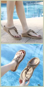 Detailed close-up of T-strap flat sandals featuring rhinestone accents and heart buckle