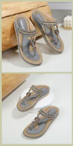 Detail of beaded women's sandals with rhinestone hearts and woven straps on wood