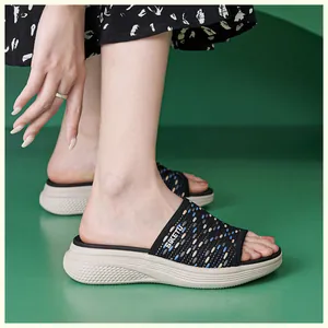 Detail view of woven knit upper on wedge sandals featuring a non-slip platform sole