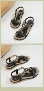 Detail of bohemian flat sandals with sparkling rhinestones and elastic heel strap