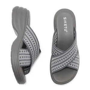 Women's dark grey platform wedge sandals with woven cross strap and thick sole design