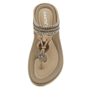 Bohemian thong sandals for women with rhinestones and decorative heart charms in beige