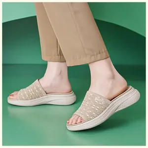 Close-up of beige knitted wedge sandals for women with breathable mesh and thick anti-slip sole