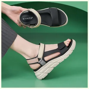 Detail of wedge sandals showing non-slip thick soles and adjustable velcro straps