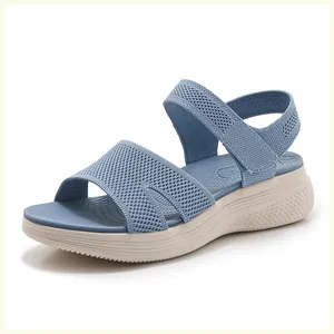 Macro detail of blue knitted fabric upper and wedge platform sole on summer sandals
