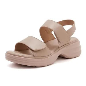Macro detail of breathable perforated footbed and chunky wedge sole of the sandal