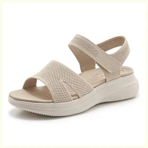 Close-up of beige knit platform sandal with Velcro strap and breathable woven texture