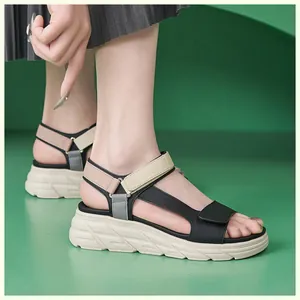 Detail view of platform sandals with multi-color patchwork and non-slip wavy sole