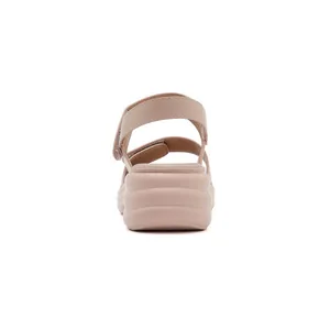 Rear view of platform sandals featuring adjustable velcro straps and wavy soles