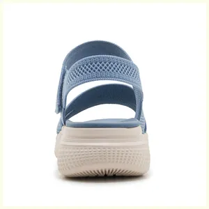 Detail view of the elastic blue fabric upper and thick anti-slip sole on women's sandals