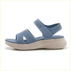 Detail view of the breathable navy knit upper and anti-slip platform sole on beach sandals