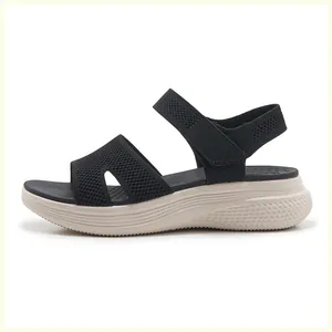 Detail view of the breathable mesh upper and platform sole on these black summer sandals