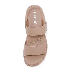 Close-up of beige platform sandals featuring breathable perforated insoles and dual straps