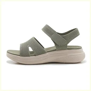 Detail view of olive green knitted platform sandals with adjustable velcro straps