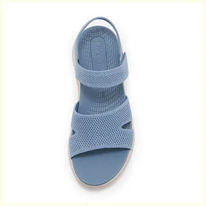 Vertical top view of blue knitted mesh sandals with elastic heel strap and SIKETU logo