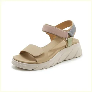 Detail of colorful patchwork straps and thick wedge sole on casual women's sandals