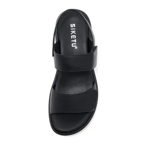 Top view of black leather open-toe sandals featuring breathable perforated insoles