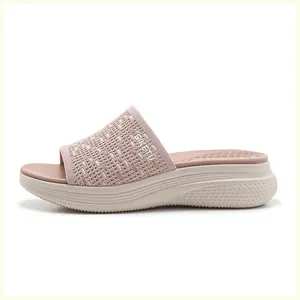Detail of the thick cushioned midsole and knit breathable upper of the platform slippers