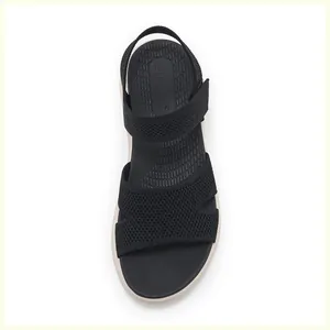 Detailed top view of a black sporty sandal with non-slip texture and brand logo