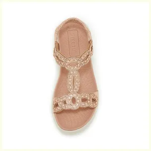 Detaillierte Draufsicht auf roségoldene T-Riemen-Sandalen mit Strasssteinen und elastischer Ferse