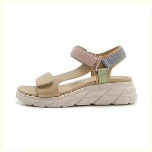 Detail view of multi-color thick platform sandals featuring velcro straps and non-slip sole