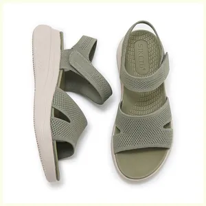 Detail view of the breathable knitted straps and non-slip footbed on platform sandals