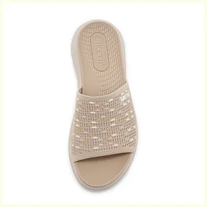 Top view of comfortable thick-soled beige slide sandals with breathable knitted straps