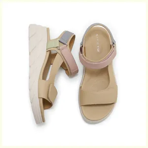 Close-up of lightweight platform sandals featuring multi-color straps and velcro closure