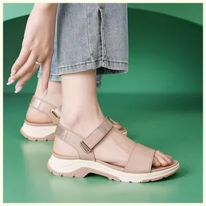 Detail view of beige platform sandals with adjustable straps and textured non-slip sole