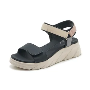 Women's chunky platform sandals with beige and black color-block straps and velcro closure