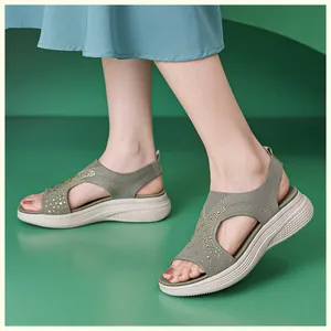Detail of olive green knit sandals with rhinestone accents and comfortable thick soles