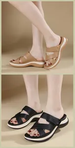 Close-up of stylish platform slide sandals in black and brown with cross band design