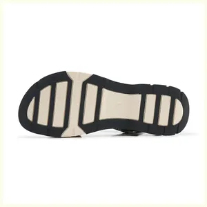 Detail of non-slip rubber outsole with size 36 marking on bicolor platform sandals